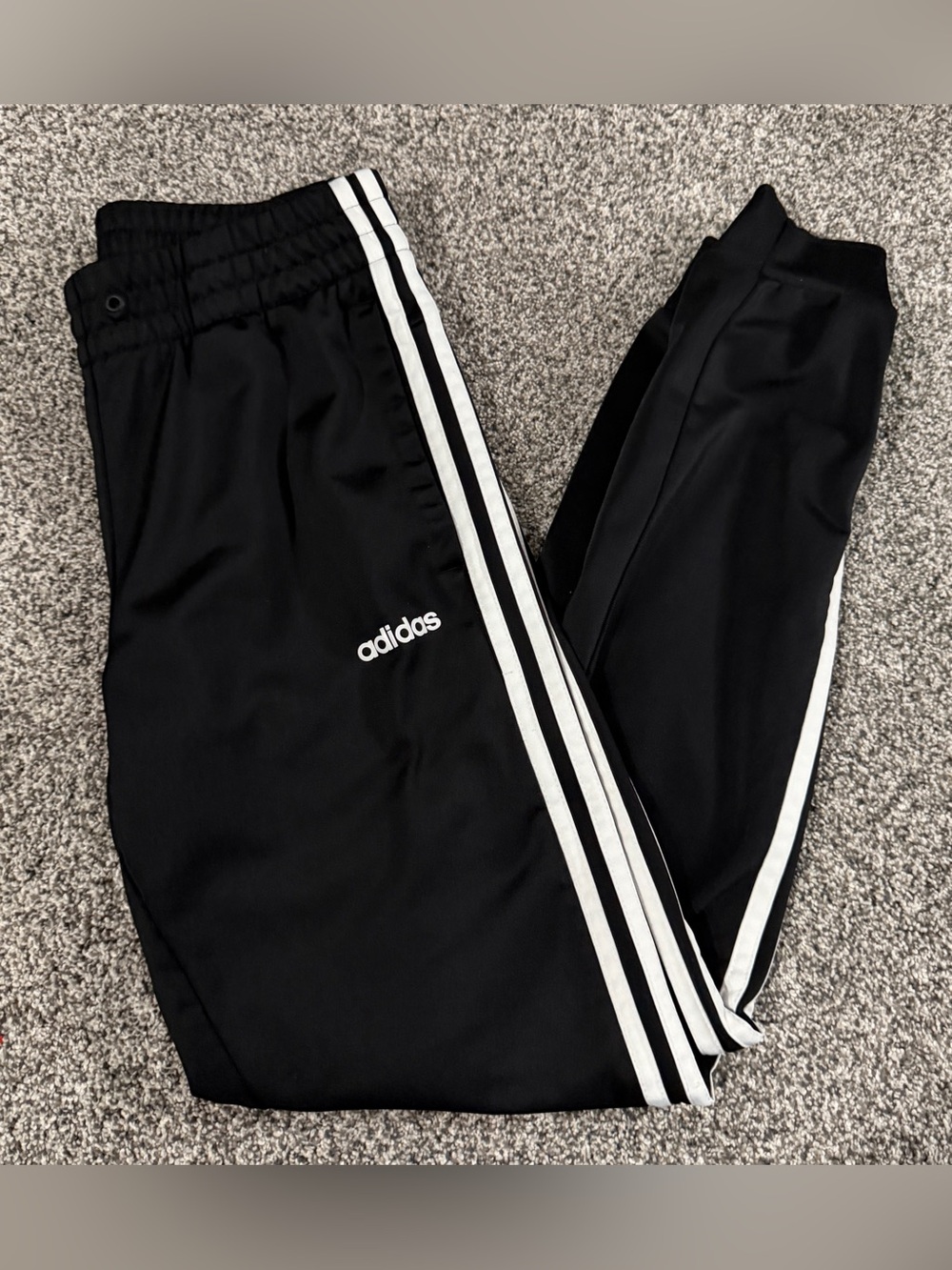 Adidas black track pants with white stripes, size S